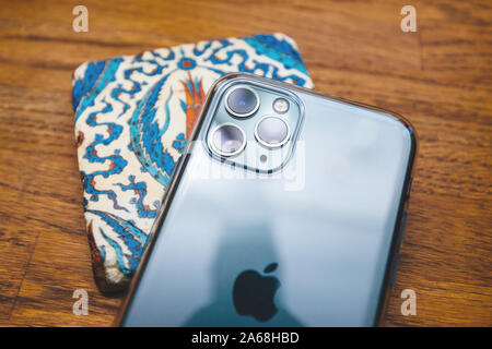 Paris, France - Oct 4, 2019: Overhead view of latest Apple Computers iPhone 11 Pro Max with Triple-lens camera on the teapad with Turkish ottoman symbols Stock Photo