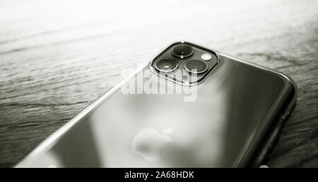 Paris, France - Oct 4, 2019: Black and white close-up macro image of the latest Apple Computers triple-lens iPhone 11 Pro Stock Photo