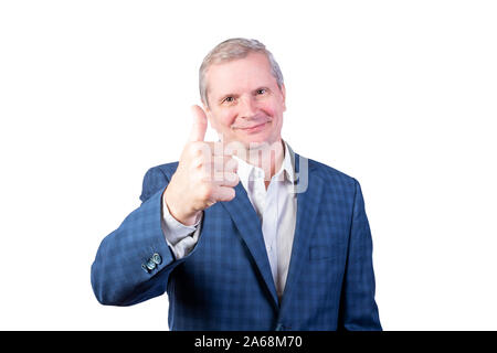 Elderly man in a suit shows thumb up. Isolated on a white background. Stock Photo