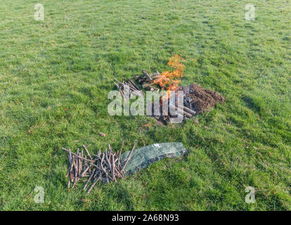 Sequential series of building and lighting survival fire or camp fire. Emergency fire, prepping, survival skills. See additional explanatory NOTES. Stock Photo