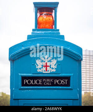 Vintage Police telephone box no longer in use, Victoria Embankment alongside the River Thames, London, UK. Stock Photo