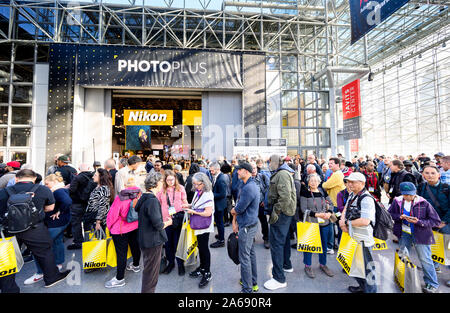 Customers line up to get into the PhotoPlus Expo conference held at the Jacob K. Javits Convention Center in New York. Stock Photo