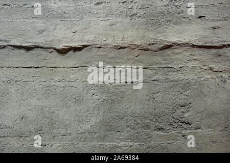 Dark Grey rough bumpy raw concrete texture wall. Loft style. Stock Photo
