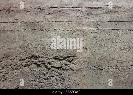 Dark Grey rough bumpy raw concrete texture wall. Loft style. Stock Photo