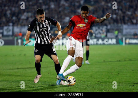 Belgrade. 24th Oct, 2019. Manchester United's Anthony Martial (R) vies with Partizan's Sasa Zdjelar during a UEFA Europa League Group L football match between Partizan and Manchester United in Belgrade, Serbia on Oct. 24, 2019. Credit: Predrag Milosavljevic/Xinhua/Alamy Live News Stock Photo