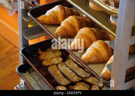 Boothbay Harbor, ME / USA - October 20, 2019: Delicious rolls and various breads in a sheet pan rack Stock Photo