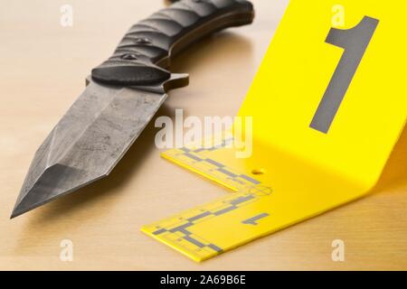 Crime scene investigation CSI evidence marker with empty, fired bullet  casings Stock Photo by ©shawn_hempel 317125746