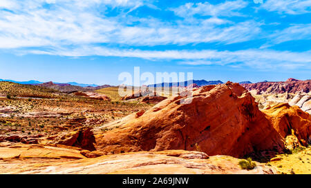 The colorful red, yellow and white banded rock formations along the Fire Wave Trail in the Valley of Fire State Park in Nevada, USA Stock Photo