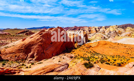 The colorful red, yellow and white banded rock formations along the Fire Wave Trail in the Valley of Fire State Park in Nevada, USA Stock Photo