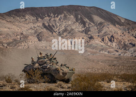 U.S. Marines with 2nd Light Armored Reconnaissance Battalion, 2nd Marine Division,  arrive at a rapid resupply point in Light Armored Vehicle 25 being refueled by Marines with Combat Logistics Battalion (CLB) 8, Combat Logistics Regiment 2, 2nd Marine Logistics Group during Integrated Training Exercise (ITX) 1-20 at Marine Corps Air Ground Combat Center Twentynine Palms, California, Oct. 22, 2019. CLB-8 integrated with 2nd Marine Regiment during ITX as the logistics combat element to provided tactical logistics in the areas of medium and heavy-lift motor transportation beyond the regiment’s or Stock Photo