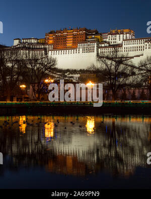 Refections of the Potala Palace at evening twilight in Lhasa, Tibet.  Former winter palace of the Dali Lama and now a UNESCO World Heritage Site.