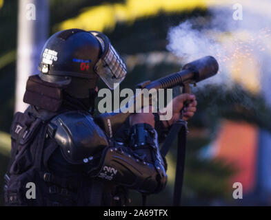 October 10, 2019: An agent of the esmad anti-riot mobile squad tries to disperse the protesters Credit: Daniel Garzon Herazo/ZUMA Wire/Alamy Live News Stock Photo