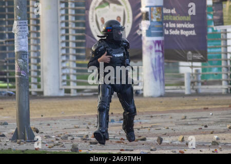 October 10, 2019: An agent of the esmad anti-riot mobile squad tries to disperse the protesters Credit: Daniel Garzon Herazo/ZUMA Wire/Alamy Live News Stock Photo