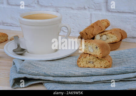 Homemade biscotti cantuccini, Italian almond sweets biscuits with  cup of coffee  on woodem table. Fresh Italian cookies cantucci background. Stock Photo