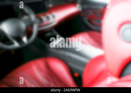 Blurred image of car interior. Dashboard. Blur defocused transportation background. Driving inside car. Bokeh light background Stock Photo