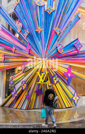 New Bond Street, London, UK. 24th Oct 2019. The refurbished Louis Vuitton  store re opens with a huge and colourful explosion of stars installation on  its corner outside wall. Credit: Guy Bell/Alamy Live News Stock Photo -  Alamy