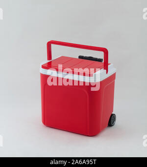 Red cooling box with wheels isolated on white background Stock Photo