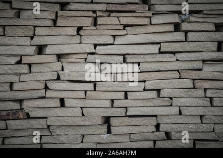 Background wall small light brown textural decorative brick Stock Photo