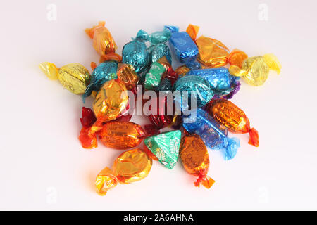 A selection of Quality Street chocolate sweets loose, isolated on white background, no tin, 2019 Stock Photo