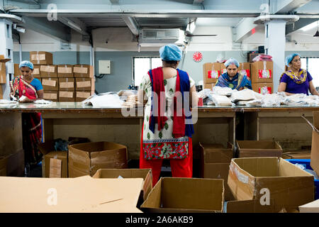 New delhi, India - 10 september 2019: group of indian women at work inside manufacturing industrial factory Women are an increasing force in the india Stock Photo