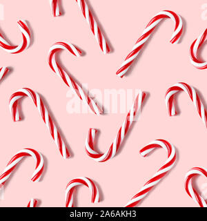 Candy cane for party design on pink background. Stock Photo