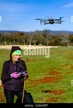 Woman with a drone in outdoor. Stock Photo