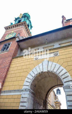 Sigismund Clock Tower of Wawel Cathedral with the arch entrance to Wawel Royal Castle, a Roman Catholic church located on Wawel Hill in Krakow, Poland Stock Photo