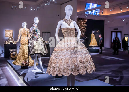 London, UK. 25th Oct 2019. Other gold dresses by Guo Pei, not for sale in the auction - GOLD: The Midas Touch bring together works from artists and artisans across the millennia who have been enchanted by gold and its power. The sale , on 29 October, will encompass Contemporary Art, Russian Works of Art & Fabergé, Design, Furniture & Decorative Arts, Asian & Indian Art, Sculpture, Old Masters, Medieval Manuscripts, Watches and Jewellery. - at Sotheby’s New Bond Street, London. Credit: Guy Bell/Alamy Live News Stock Photo