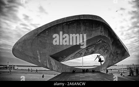 Skateboarder performing a trick in the middle of 'The Signal' sculpture by Henri Georges ADAM (1904-1967) in front of the Musée-maison de la culture in the French city of Le Havre during the summer of 2005. Stock Photo