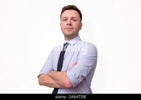 Handsome businessman with tie with folded hands. Stock Photo
