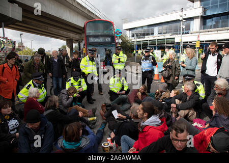 Extinction Rebellion peaceful disruption outside City Airport on 10th October 2019 in London, England, United Kingdom. The protest is against the climate and pollution impact of the government’s plans for airport expansion which will potentially double the amount of flights coming from City Airport. Extinction Rebellion is a climate change group started in 2018 and has gained a huge following of people committed to peaceful protests. These protests are highlighting that the government is not doing enough to avoid catastrophic climate change and to demand the government take radical action to s