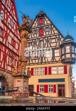 Half-timbered houses and George's spring pillar at Marktplatz (market square) in Rothenburg ob der Tauber, Bavaria, Germany, Europe, one of the most p Stock Photo
