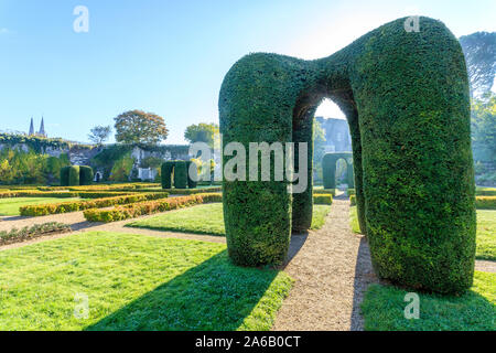France, Maine et Loire, Angers, Chateau d’Angers, Angers castle, in the main courtyard, the Regular garden with yews arches prune into topiary // Fran Stock Photo