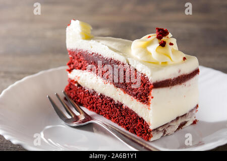 Red velvet cake slice on wooden table Stock Photo