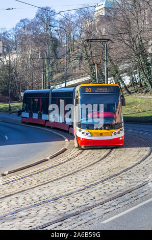 PRAGUE, CZECH REPUBLIC - FEBRUARY 15: Modern tram rides down the street at February 15, 2019 in Prague, Czech Republic Stock Photo