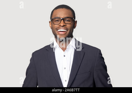 Head shot portrait smiling African American businessman wearing glasses Stock Photo