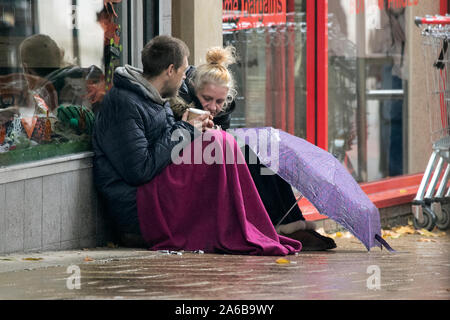 Preston, Lancashire, UK. 25th October 2019.  Absolutely atrocious conditions as torrential rainfall pours down on the shoppers braving the city streets of Preston in Lancashire.  All coats and umbrellas at the ready as the unsettled Autumnal weather strikes at a moments notice in the north west region of England.  Credit: Cernan Elias/17�Թ����� Live News Stock Photo