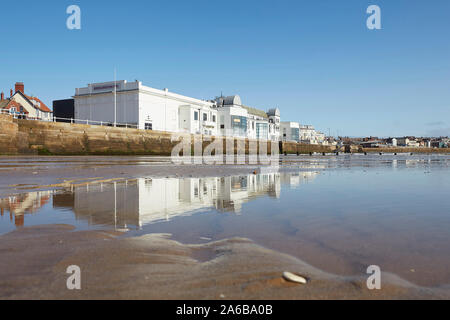 Bridlington spa theatre on the south promenade reflected in the sands of the south beach, East Yorkshire, England, UK Stock Photo