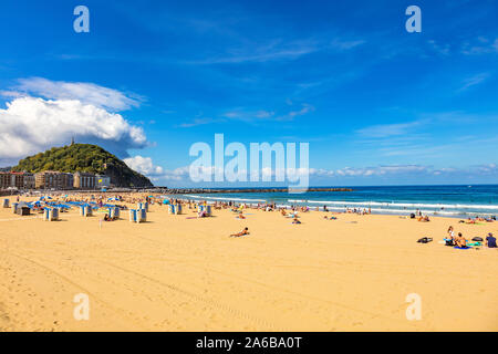 San Sebastian, Spain - September 07, 2019 - Beach view, surfers and tourists Stock Photo