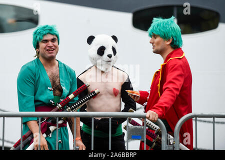 London, UK.  25 October 2019. Men in costume join cosplayers from all over the world on the opening day of the bi-annual MCM Comic Con event at the Excel Centre in Docklands.  The event celebrates popular culture such as video, games, manga and anime providing many attendees with the opportunity to dress up as their favourite characters. Credit: Stephen Chung / Alamy Live News Stock Photo