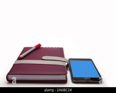 Mobile phone on book , on white background Stock Photo