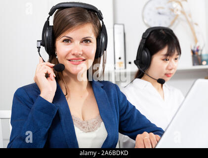 Operators working with computers in an office Stock Photo