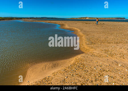 Saltwater pools on Holkham beach looking across the river Burn estuary to Scolt Head Island National Nature Reserve on North Norfolk coast, England UK Stock Photo