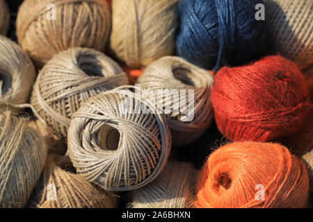 Colored cotton thread balls background Stock Photo