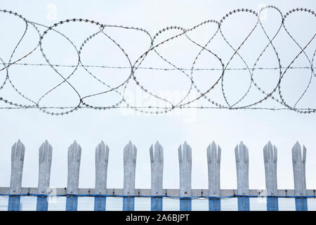 Razor wire security fence at private prison for security Stock Photo