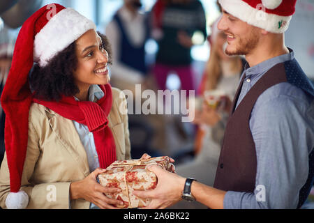 Business people celebrating Christmas. Coworker celebrating Christmas in office together. Stock Photo