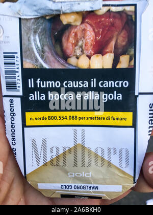 Italian Marlboro cigarettes pack with signs signalizing risks of cancer, Milan, Lombardia, Italy Stock Photo