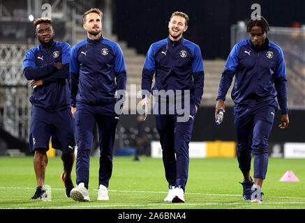 Luton Town players Kazenga LuaLua, Andrew Shinnie, Pelly-Ruddock Mpanzu and Corey Panter before the game Stock Photo