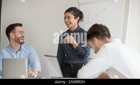 Colleagues laughing, having fun during working process Stock Photo