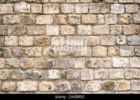 Background from a rough brown natural stone wall Stock Photo